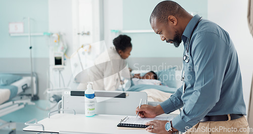 Image of Doctor, writing and hospital documents for patient, family or child insurance, checklist and healthcare history. Professional african man or pediatrician in medical clinic with paperwork or charts