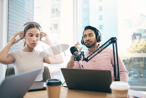 Image of Man, woman and podcast with live streaming, conversation and technology with happiness, news or media broadcasting. People, presenters or coworkers with microphone, radio or discussion with talk show