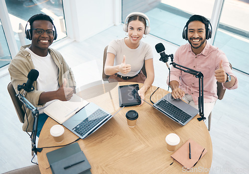 Image of Thumbs up, people in radio and hosting talk show, broadcast and content creation with people in portrait. Headphones, laptop and mic, podcast success and influencer with top, hand gesture and media