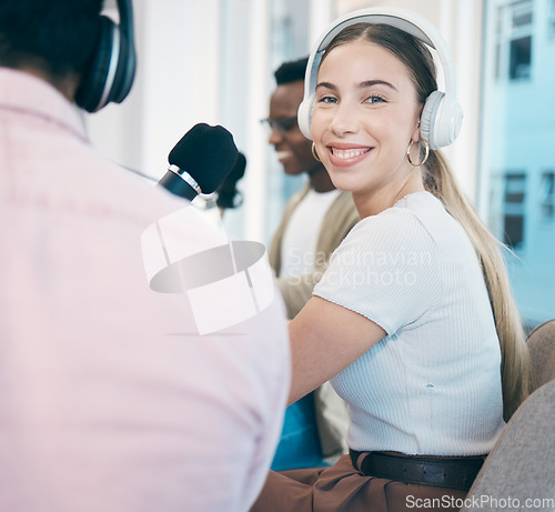 Image of Radio, podcast and portrait of woman in office in conversation with people, headphones and microphone. Recording, broadcast and speaker hosting a group interview, show and influencer business