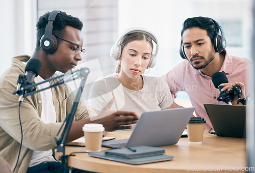 Image of Men, woman and laptop with microphone, podcast or idea for chat, creativity or opinion on live stream. Group, microphone and headphones for web talk show, broadcast or think for collaboration at desk