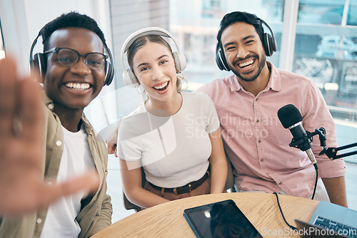 Image of Podcast, portrait and group selfie of happy friends together, live streaming or people recording broadcast. Face, team and radio hosts take picture at table for social media blog on headphones or mic