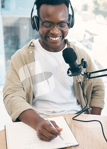 Image of Live stream, podcast or black man with notebook, microphone or headphones with news broadcasting. Smile, African person or radio presenter with tech, public relations or writing with content creator