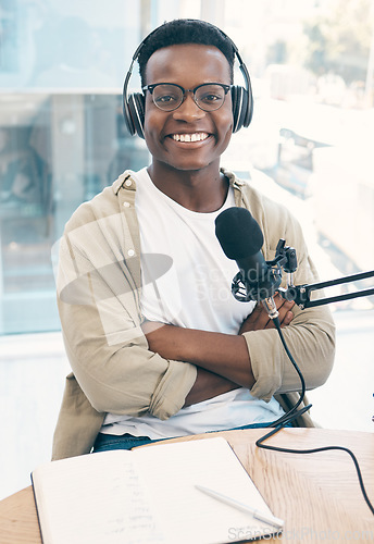 Image of Portrait, radio and black man with a notebook, microphone and arms crossed with content creator, live stream and news. Face, African person or podcast presenter with tech, share information and media