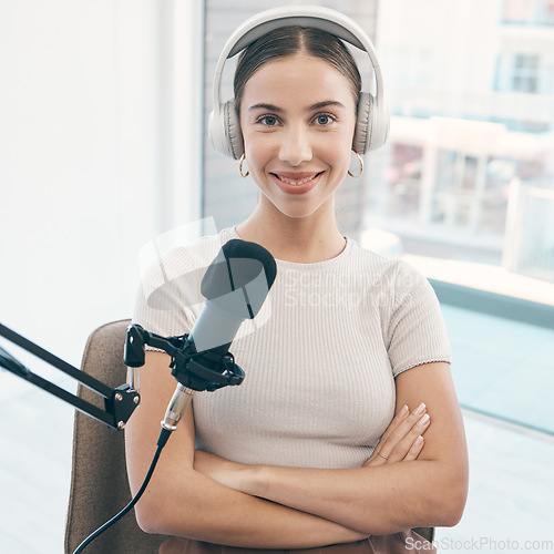 Image of Radio presenter, portrait and happy woman with arms crossed in a booth for live streaming, broadcast or reporting. Speech, face and proud female talk show host smile in a studio for news announcement