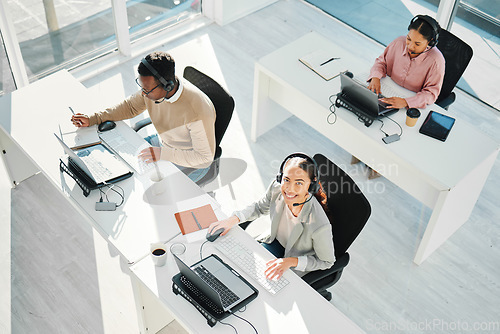 Image of Call center, woman and smile in portrait with laptop, telemarketing staff and voip tech from above. Help desk agent, computer and customer service for contact us, technical support and consulting