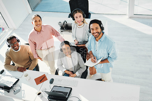 Image of Happy telemarketing team, portrait and group in call center for customer service, IT support or collaboration in coworking agency from above. Diversity, sales people and smile for consulting together