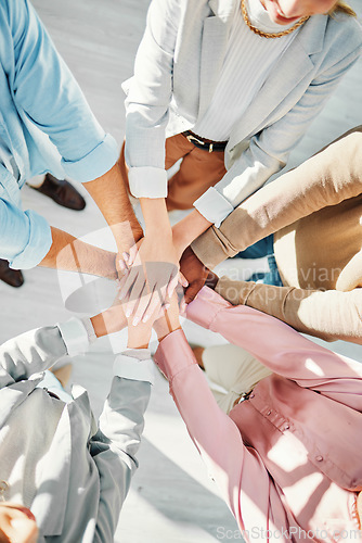 Image of Teamwork, hands and business people in collaboration from above for support, circle of trust and winning. Closeup, partnership and team building for success, cooperation and synergy for achievement