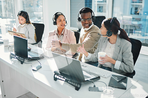 Image of Call center, staff group and talk at help desk with laptop, telemarketing or voip tech with problem solving. Women, man and customer service agent for contact us, technical support or consulting team