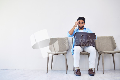 Image of Bag, stress and man search in waiting room for interview, hiring and recruitment with lost resume in briefcase. Problem, finding and person forget laptop or keys by mistake, frustration and worried