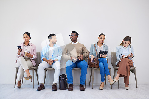 Image of Job interview, recruitment and waiting room with business people networking or diversity for meeting. We are hiring, human resources and candidate group online in office for research, survey or info