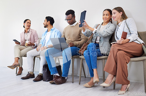 Image of Group of people, waiting room and interview at job recruitment agency with laptop, tablet and resume. Human resources, hiring and business men and women in lobby together with career opportunity.