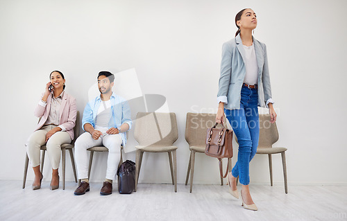 Image of Business people, waiting room and chairs in hiring, row or opportunity together at office. Group of employees sitting in line for recruiting, meeting or team in startup for job or career at workplace
