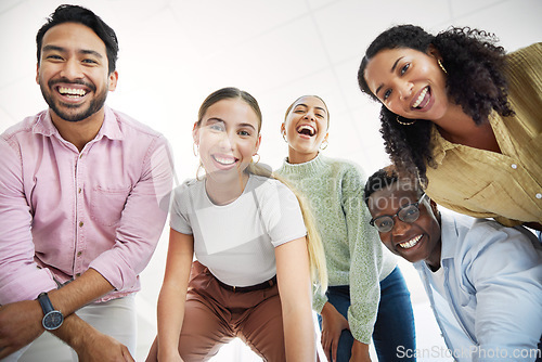 Image of Below, smile and portrait of happy employees excited in team building together and colleagues in collaboration. Bonding, joy and group of business people with unity in teamwork in startup company