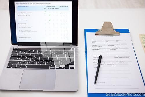 Image of Health, checklist and laptop on table in office, hospital or survey information and insurance data. Paperwork, questions and computer with form for medical results, report and healthcare review