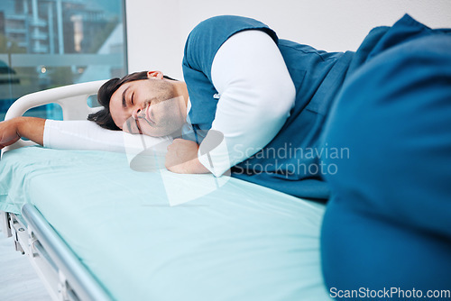 Image of Sleeping, hospital and tired doctor for rest, nap and break for burnout, exhausted and fatigue. Healthcare, night shift and health worker relax for medical service, wellness and stress in clinic bed