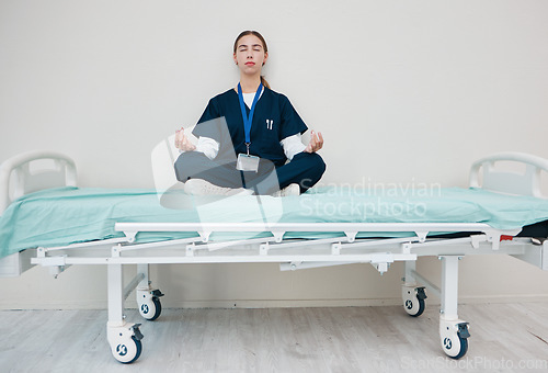 Image of Doctor, woman and meditate to relax in hospital, healing and break from work, yoga and calm for mental health. Medical professional, peace and wellness for aura, zen and chakra for balance in career