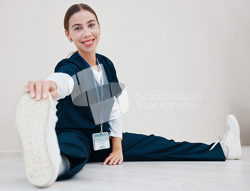 Image of Stretching, feet and nurse with legs on floor in exercise at the start of shift in clinic internship or healthcare. Work, preparation and portrait of warm up body for wellness and fitness in hospital