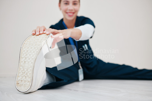 Image of Feet, stretching and nurse with legs on floor in exercise at the start of shift in healthcare, clinic or internship. Work, preparation or portrait of warm up body for wellness and fitness in hospital