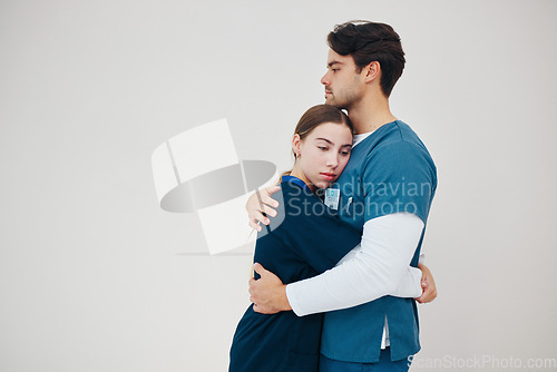 Image of Doctor, colleagues and tired fatigue or support at healthcare clinic, work stress or hug. Medical professionals, friends or helping comfort in scrubs on wall background, mockup or burnout at hospital