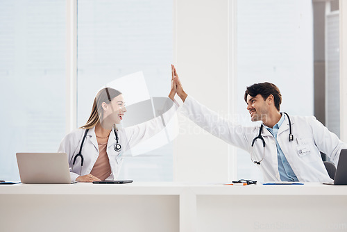 Image of Success, high five or doctors in meeting for a strategy, goals or working in hospital for healthcare together. Man, happy woman or excited surgeons with nursing target, medical mission or teamwork