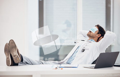 Image of Man, doctor and sleeping with face mask in relax for done, completion or finished at hospital office. Tired male person, medical surgeon chilling on break, rest or asleep on work desk at clinic