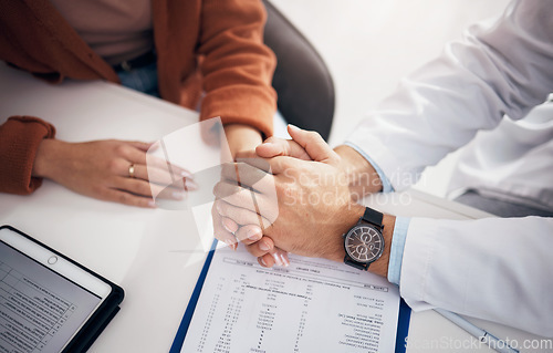 Image of Diagnosis, results and doctor holding hands with patient for support, care and kindness in clinic or hospital. Healthcare, empathy and counseling person with medical, report and announcement of news