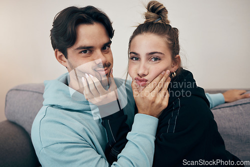 Image of Relax, cute and portrait of couple on sofa for bonding, healthy relationship and love in living room. Dating, happy and man and woman holding face for silly, goofy and playful fun at home together