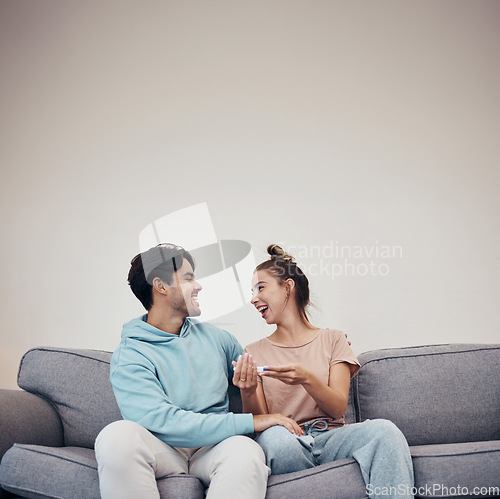 Image of Pregnancy test, excited and couple on sofa in home, reading good news or check results on mockup space. Kit, happy man and pregnant woman in living room for success, future maternity or ivf fertility