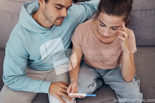 Image of Couple, pregnancy test and stress on sofa infertility, anxiety or support man. Woman, or male person or frustrated ovulation news or waiting information fear for loss, relationship problem or comfort