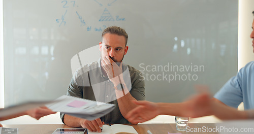 Image of Man, thinking and meeting at work or stress for team documents, tired or management. Male person, board room and table or employee strategy for collaboration papers, office fatigue or problem solving