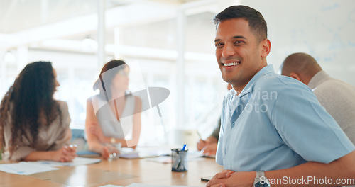 Image of Meeting, conversation and portrait of businessman in office for working on a creative project in collaboration. Teamwork, diversity and face of male designer with colleagues for planning in workplace