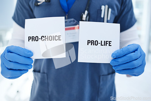 Image of Life, choice and doctor with paper in hands for abortion, human rights or decision in clinic. Nurse, poster and vote for women with option for family planning in hospital or medical contraception