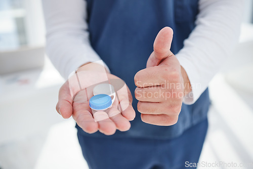 Image of Nurse, hands and contact lenses with thumbs up in clinic, vision and reading prescription in container. Man, optometrist and emoji for yes for eyecare, closeup and optometry with positive feedback