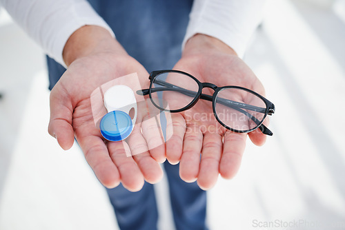 Image of Optometrist, contact lens and glasses for sight, vision or prescription for choice, laser or optician. Doctor, medicine or professional with frames, medical and health for optometry, close up or case