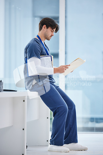 Image of Medical folder, doctor and man reading health results, healthcare records or clinic compliance policy. Services, medicine research and profile of nurse, surgeon or expert check paperwork portfolio