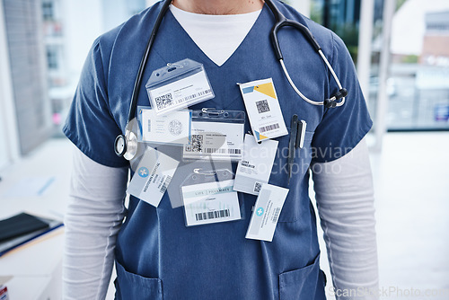 Image of Hospital, doctor and man with name tag, healthcare and promotion with progress, surgeon and nurse. Zoom, person and medical professional with card, wellness and consultant with physician in a clinic