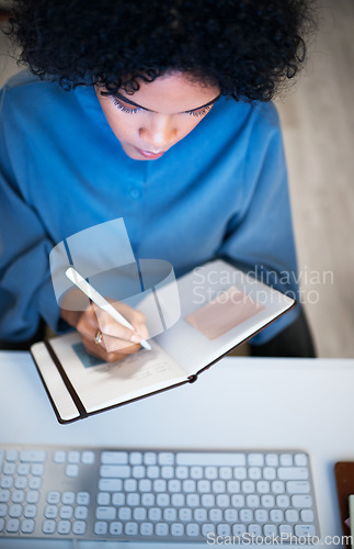 Image of Woman with notebook, writing and checking schedule, agenda and reminder for office administration. Calendar, diary or journal, girl at desk planning notes for time management productivity from above.