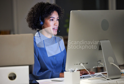 Image of Computer, call center and night business woman typing customer service report, telemarketing and help desk advice. Overtime tech support, communication and advisory agent working on ecommerce sales