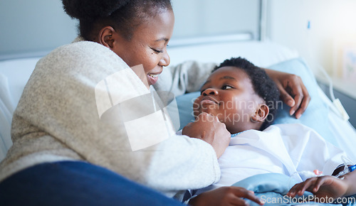 Image of Hospital, bed and black woman with care for child, wellness and hug with a smile in bedroom. Sick, kid and mother embrace with love and gratitude for health, healing and happy for medicine in clinic