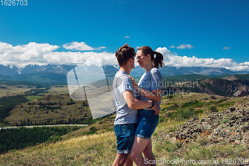 Image of Loving couple together on mountain