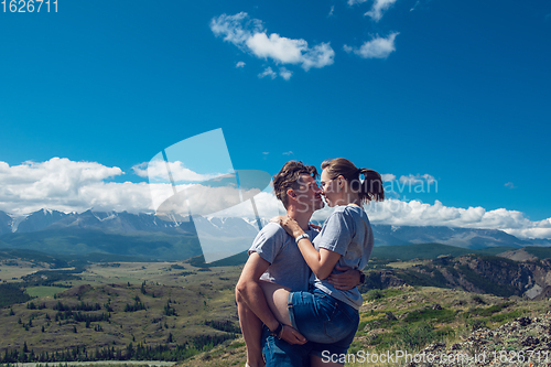 Image of Loving couple together on mountain