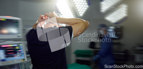 Image of Surgeon tie mask in hospital, operation theatre or busy clinic for medial health or protection in emergency room. Back, doctor tying cap or surgery preparation in scrubs, safety ppe or uniform of man