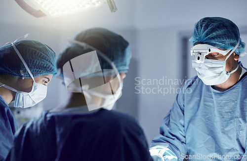 Image of Surgery, team and mask on face with glasses for medical, healthcare and working in operation room. Surgeon, teamwork and people in hospital or clinic for healing, treatment or kidney transplant