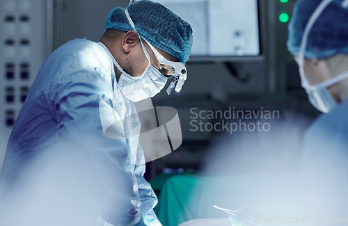 Image of Medical, teamwork and doctors in theater for surgery together, working in a clinic to save a life. Healthcare, emergency and a surgeon team in the operating room of a hospital for an operation