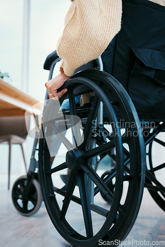 Image of Hand, wheelchair and person with a disability closeup in a home for recovery or mobility from the back. Healthcare, medical and injury with a patient in a hospital or clinic for rehabilitation