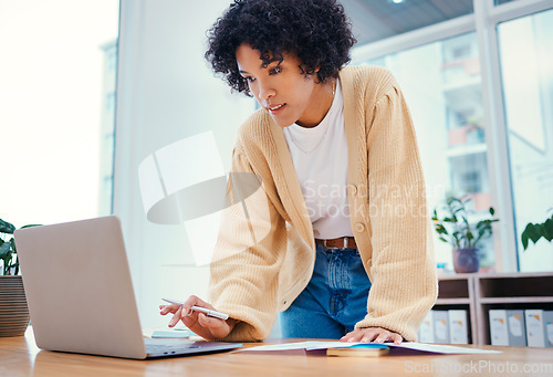 Image of Woman with laptop, notes and standing in office with admin documents, internet and ideas for freelance project. Remote work, web report and girl with computer, research paperwork and writing schedule