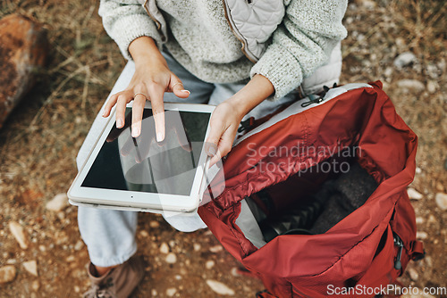 Image of Hands, hiking and a person with a tablet in nature for gps location, search or online for travel. Above, internet and a tourist typing on technology for connection while trekking in the forest