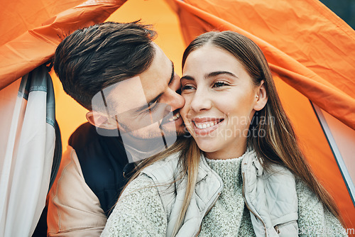 Image of Happy couple, kiss and tent for camping, holiday or outdoor vacation together in affection, bonding or nature. Face of man kissing woman with smile on camp site for travel, love or trip in adventure