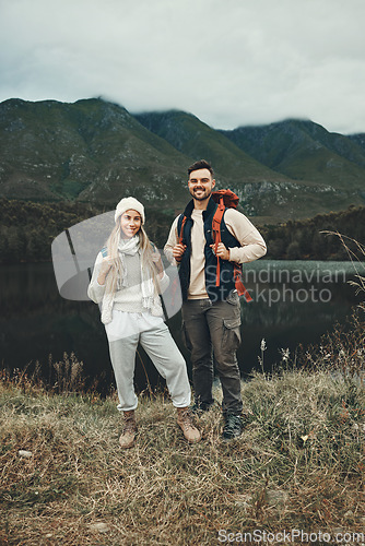 Image of Couple, hiking and portrait in nature with travel, mountain and backpacking with wilderness and explore outdoor. People camping, adventure and holiday with anniversary date, environment and trekking